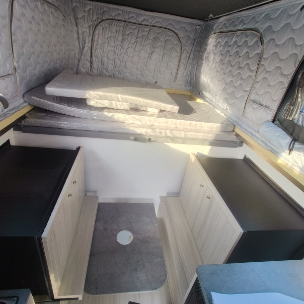 East / West Seating w / Dual Slideout Storage